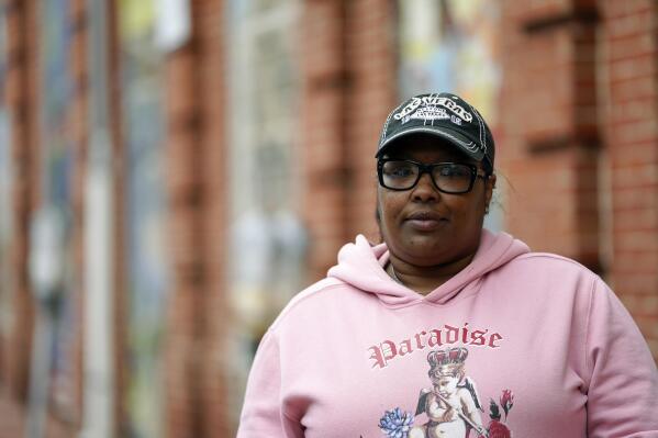 Islah Hadith poses for a photograph, Wednesday, May 3, 2023, in Baltimore. Hadith became addicted to pain killers in her 20s when she broke her ankle playing basketball in high heels. The Baltimore City Health Department's harm reduction program uses an RV to address the opioid crisis, which includes expanding access to medication assisted treatment by deploying a team of medical staff to neighborhoods with high rates of substance abuse and offering buprenorphine prescriptions. (AP Photo/Julio Cortez)