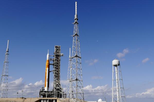 NASA's new moon rocket sits on Launch Pad 39-B Monday, Nov. 14, 2022, in Cape Canaveral, Fla. NASA's 21st-century moon-exploration program, named Artemis after Apollo's mythological twin sister. NASA is targeting an early Wednesday morning launch attempt. (AP Photo/John Raoux)